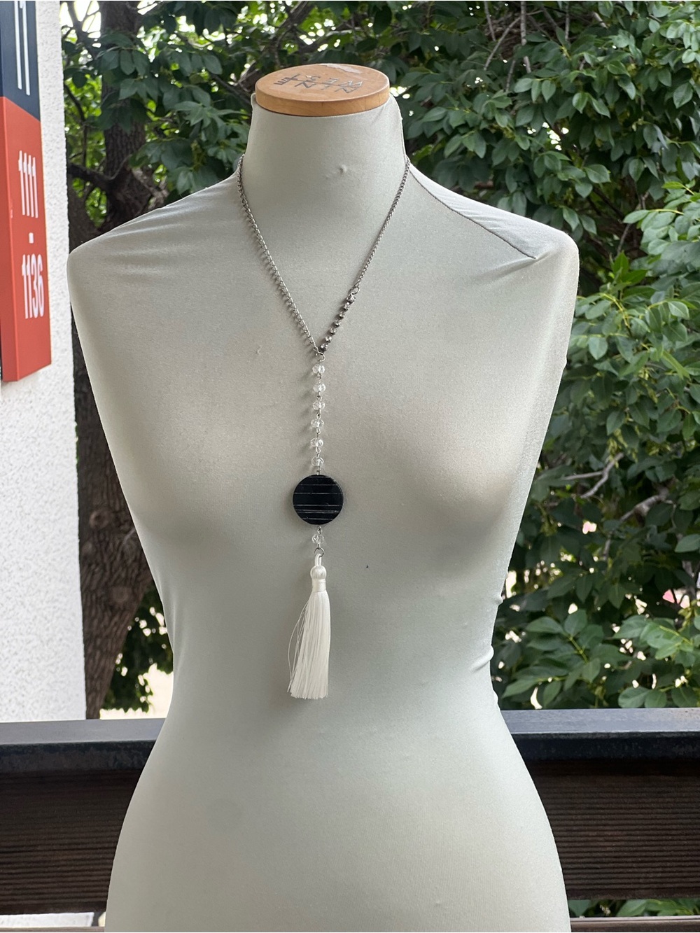 Handcrafted Silver Tassel Necklace with Black Disc and White Tassel